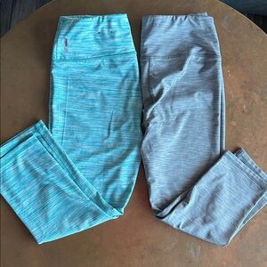 Two pairs of RBX medium capri’s: teal and gray